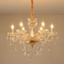 Lustre de ouro com lustre de vela de cristal transparente